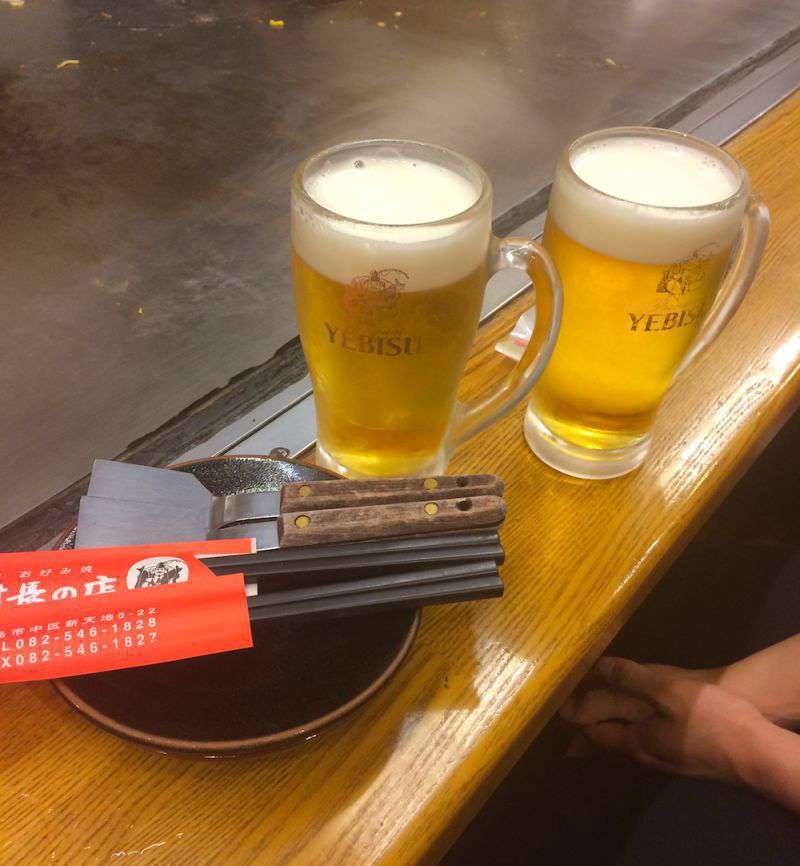 Photograph of A cold beer is the best accompaniment to okonomiyaki