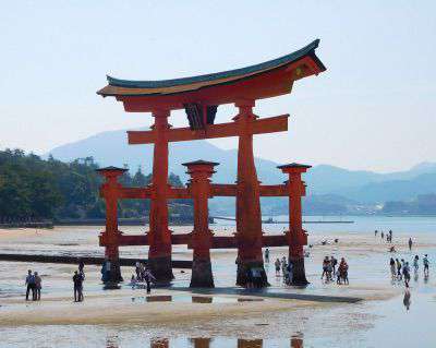 Visit Miyajima and experience a stunning Shinto shrine set on a beautiful island