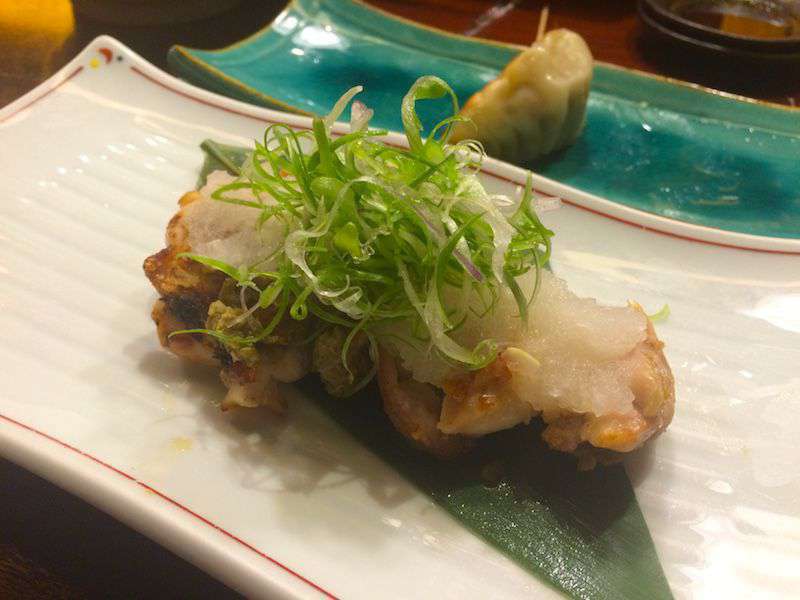 Photograph of Onegiya's grilled chicken served with the negi onions