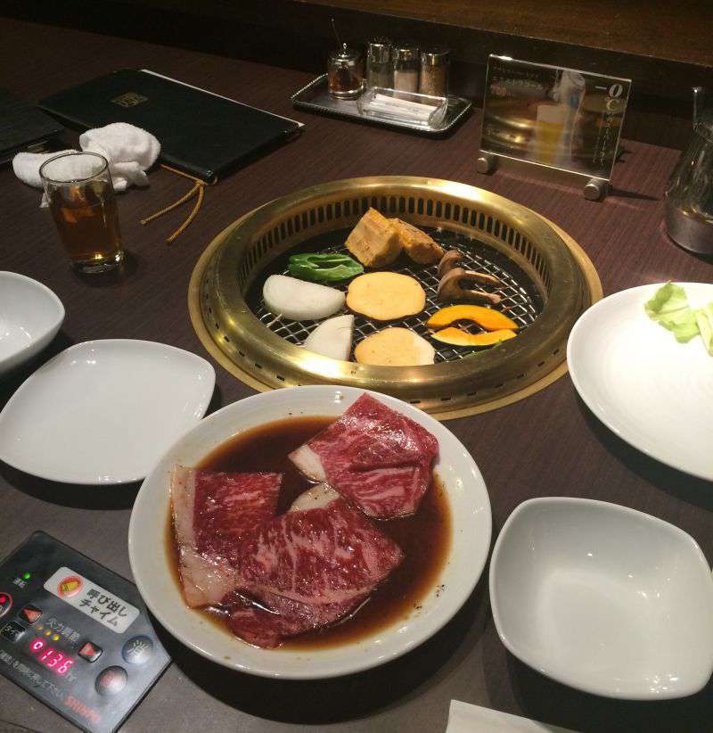 Photograph of Tendan yakiniku restaurant - meat and vegetables on the barbeque grill!